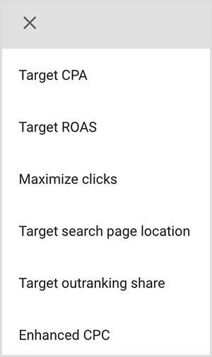Esta é uma captura de tela de um menu de opções de segmentação no Google Ads. As opções são CPA desejado, ROAS desejado, Maximizar cliques, Local da página de pesquisa desejada, Parcela de superação desejada, CPC otimizado. Mike Rhodes diz que as opções de segmentação inteligente no Google Ads usam inteligência artificial para encontrar pessoas com a intenção certa para seu anúncio.